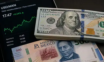 Billetes de dólares estadounidenses y pesos mexicanos representan el tipo de cambio de este miércoles 29 de julio de 2026.