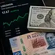 Billetes de dólares estadounidenses y pesos mexicanos representan el tipo de cambio de este miércoles 29 de julio de 2026.
