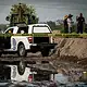 Bomberos de Tlajomulco trabajan en el canal de Las Pintas donde fue localizado el cuerpo de un hombre.